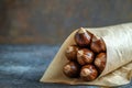 Roasted Chestnuts in a Brown Paper Wrapper Royalty Free Stock Photo