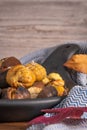 Roasted chestnuts in cast iron pan on an old board Royalty Free Stock Photo