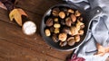 Roasted chestnuts in cast iron pan Royalty Free Stock Photo