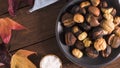 Roasted chestnuts in cast iron pan Royalty Free Stock Photo