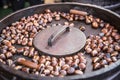 Roasted chestnuts in a frying pan somewhere in the street market