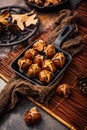 Roasted chestnuts in iron pan on old kitchen table