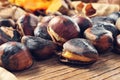 Roasted chestnuts on a rustic wooden table Royalty Free Stock Photo