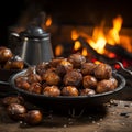 roasted chestnuts in a steel bowl resting on a table. sitting in front of a fire.