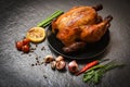 Roasted chicken / baked whole chicken grilled with on herbs and spices and dark Royalty Free Stock Photo