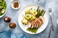 Roasted chicken breast, boiled new potato and grilled asparagus Royalty Free Stock Photo