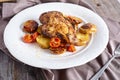 Roasted chicken breast on white plate