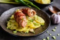 Roasted chicken cutlets wrapped in bacon and served with potato Royalty Free Stock Photo