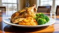 Roasted chicken dinner on a table with vibrant colors and natural light coming through the window Royalty Free Stock Photo