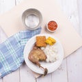 Roasted chicken with fried tofu, tempeh, chilli sauce, and white rice Royalty Free Stock Photo