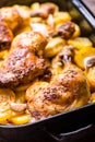 Roasted chicken leg with potatoes with caraway and garlic Royalty Free Stock Photo