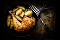 Roasted chicken leg with potatoes Royalty Free Stock Photo