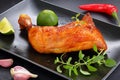 Roasted chicken leg quarter on plate Royalty Free Stock Photo