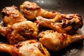 Roasted chicken legs on the black background. Top view