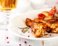 Roasted chicken legs and a glass of beer Royalty Free Stock Photo