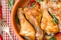 Roasted chicken legs with rosemary, garlic and red chili pepper Royalty Free Stock Photo