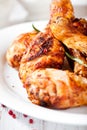 Roasted chicken legs with rosemary and pnk pepper Royalty Free Stock Photo