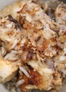 Roasted chicken with onion closeup