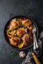 Roasted chicken with orange, cranberry and spicy herbs on pan