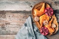 Roasted chicken with pomegranate and garlic on wooden background. Friends or family dinner. Festive Christmas table. Top view. Royalty Free Stock Photo