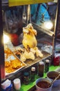 Roasted chicken in a street restaurant in Bangkok, Thailand