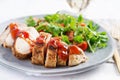 Roasted chicken fillet with salad fresh tomatoes and arugula
