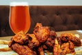 Roasted chicken wings and glass of beer Royalty Free Stock Photo