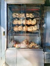 roasted chickens cooked in a spiedo food oven