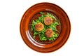 Roasted chickpeas falafel patties with arugula on a plate. Isolated on white background. Royalty Free Stock Photo