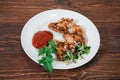 Roasted chiken wings on a plate Royalty Free Stock Photo