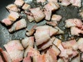 Fried fat bacon close-up in a frying pan, butter with bubbles close-up. Selective focus Royalty Free Stock Photo