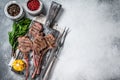 Roasted chops steaks of lamb mutton on a wooden board. White background. Top view. Copy space Royalty Free Stock Photo