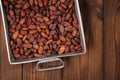 roasted cocoa chocolate beans in Vintage heavy cast aluminum roasting pan