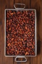 Roasted cocoa chocolate beans in Vintage heavy cast aluminum roa Royalty Free Stock Photo