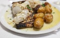 Roasted codfish with potatoes or Bacalhau a Bras