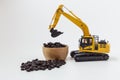 Coffee bean concept in scoop bucket of excavator