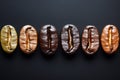 Roasted coffee beans arranged in a row, displaying a gradient of colors from light to dark, illustrating the roasting process Royalty Free Stock Photo