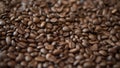 Roasted coffee beans background.Close-up,coffee processing at the enterprise Royalty Free Stock Photo