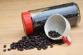 Roasted coffee beans in the bottele and cup Royalty Free Stock Photo