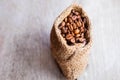 Roasted coffee beans in a brown sack bag. Royalty Free Stock Photo