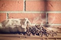 Roasted coffee beans in burlap sack Royalty Free Stock Photo