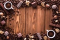 Roasted coffee beans, chocolate, candy, nuts, cup and the frame for inscriptions on wooden background Royalty Free Stock Photo