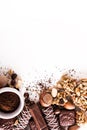 Roasted coffee beans, chocolate, candy, nuts, cup and the place for inscriptions on white background Royalty Free Stock Photo