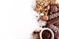 Roasted coffee beans, chocolate, candy, nuts, cup and the place for inscriptions on white background Royalty Free Stock Photo