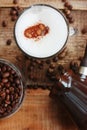 Roasted coffee beans and a cinnamon Dolce latte