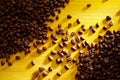 Roasted coffee beans on colorful yellow wood Royalty Free Stock Photo