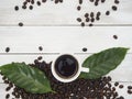 Roasted coffee beans and coffee cup Royalty Free Stock Photo