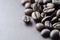 Roasted coffee beans on dark brown background