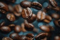 Roasted coffee beans falling down with blue background Royalty Free Stock Photo