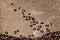 Roasted coffee beans  falling down on vintage cardboard paper background Royalty Free Stock Photo